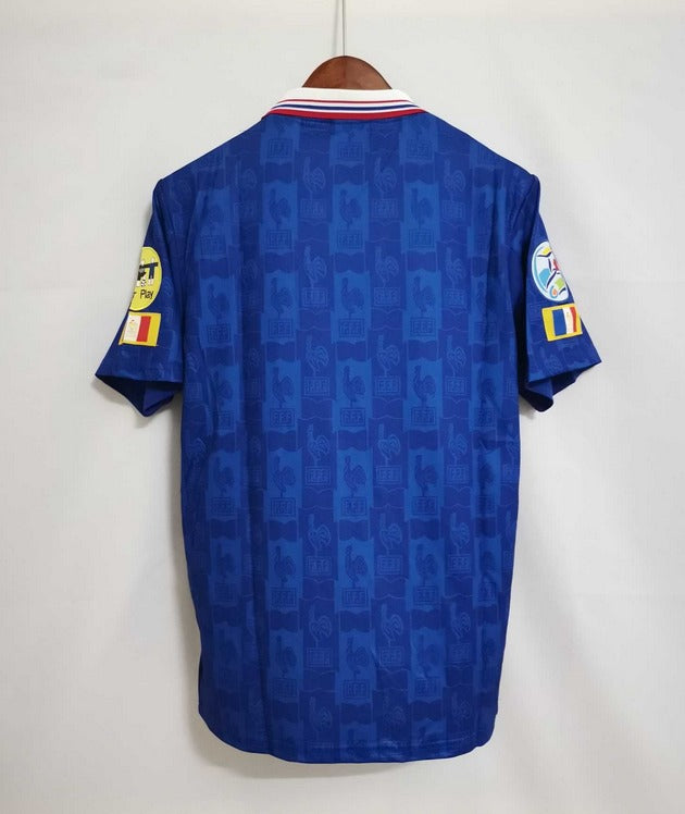 Blue sports jersey with visible branding on a white background