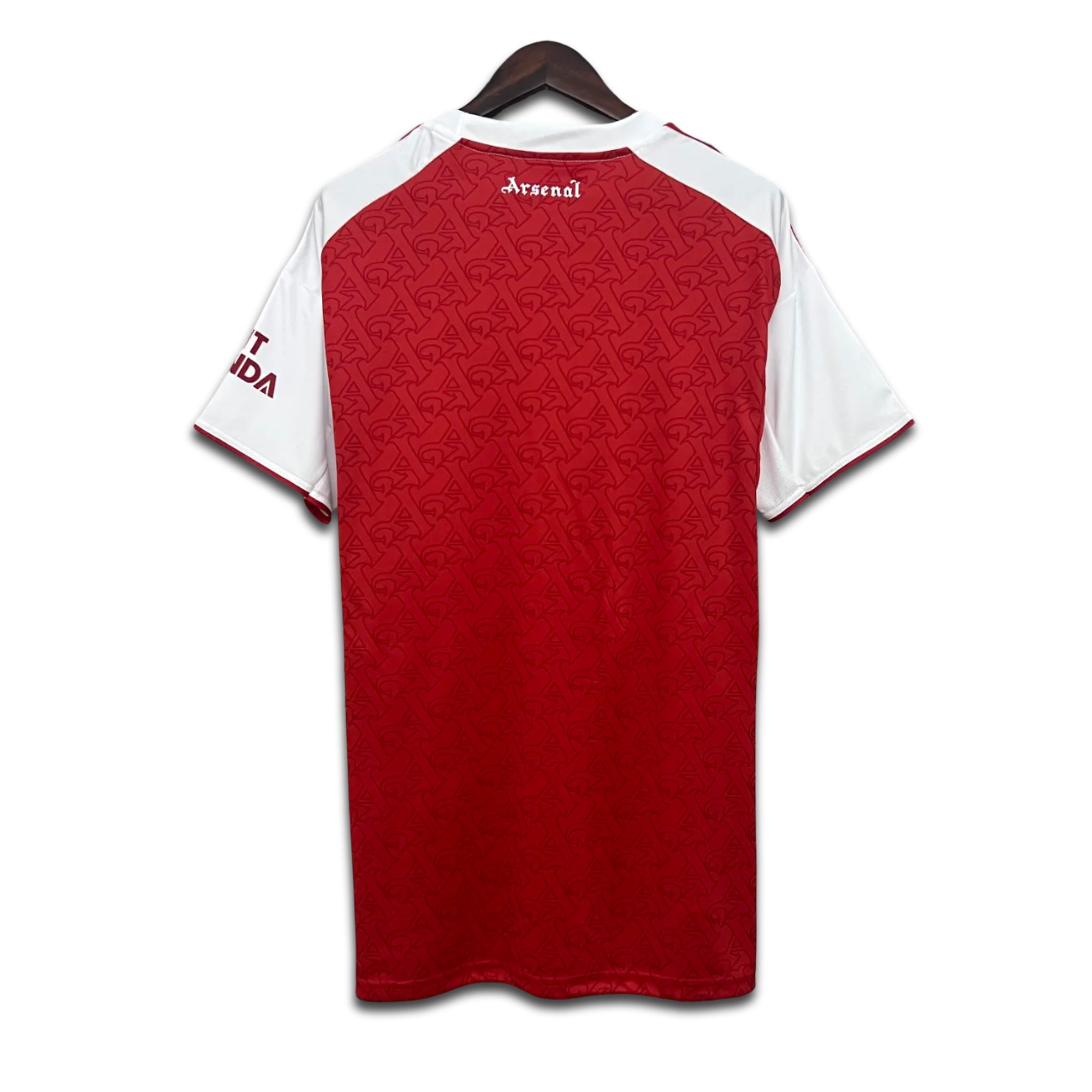 Red and white Arsenal sports jersey on a hanger with a white background