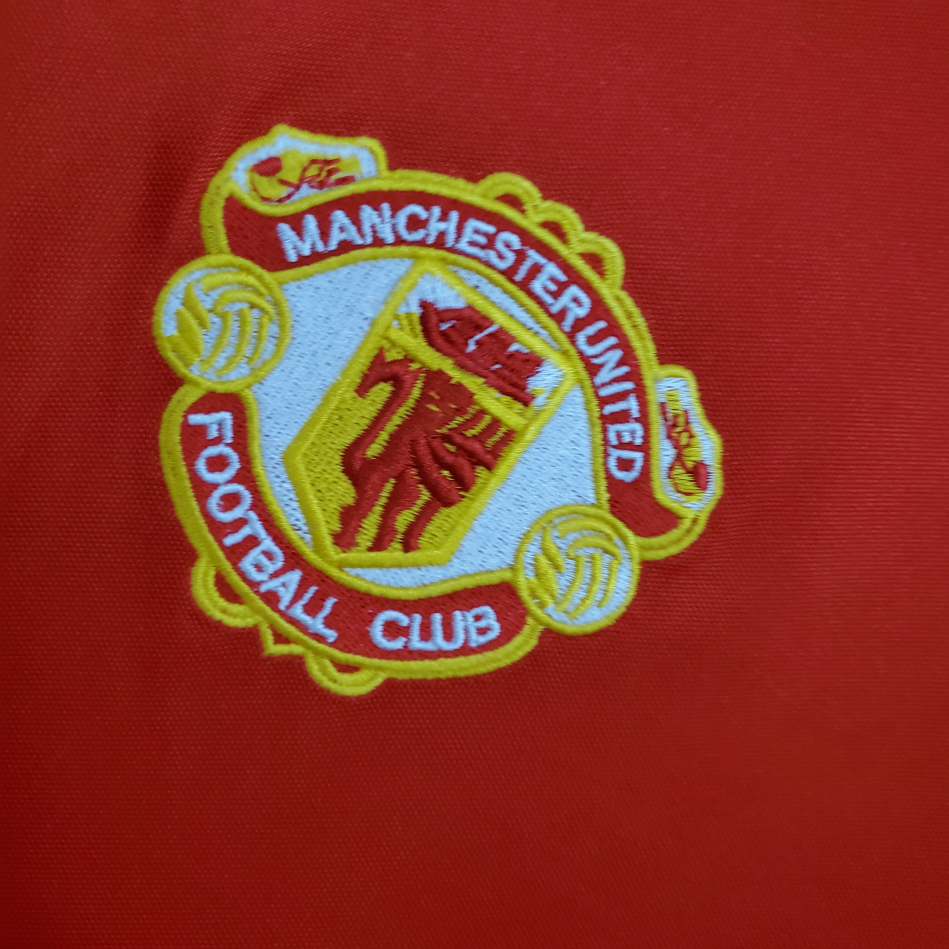 embraided Manchester United badge from the 1986 home shirt