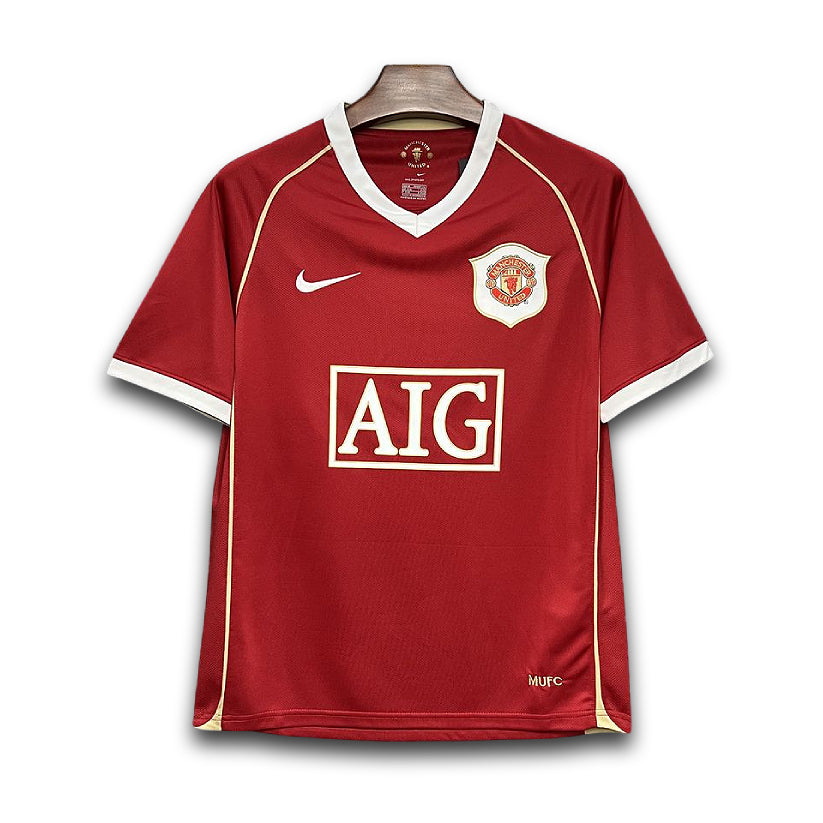 Manchester United retro AIG shirt from the 2006/07 season where legends of the game like Cristiano Ronaldo, displayed his excellence in Manchester Red.