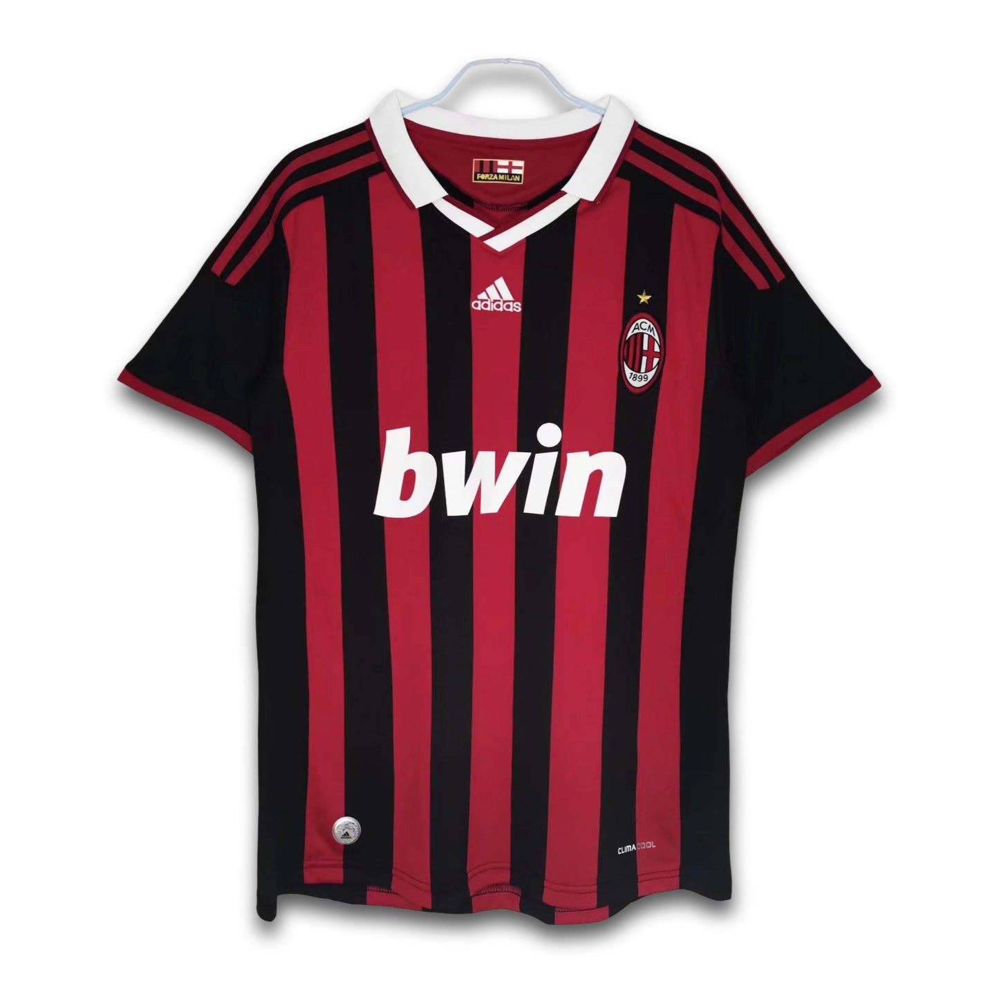 A soccer jersey with red and black stripes, featuring the Bwin sponsor logo and Adidas branding.