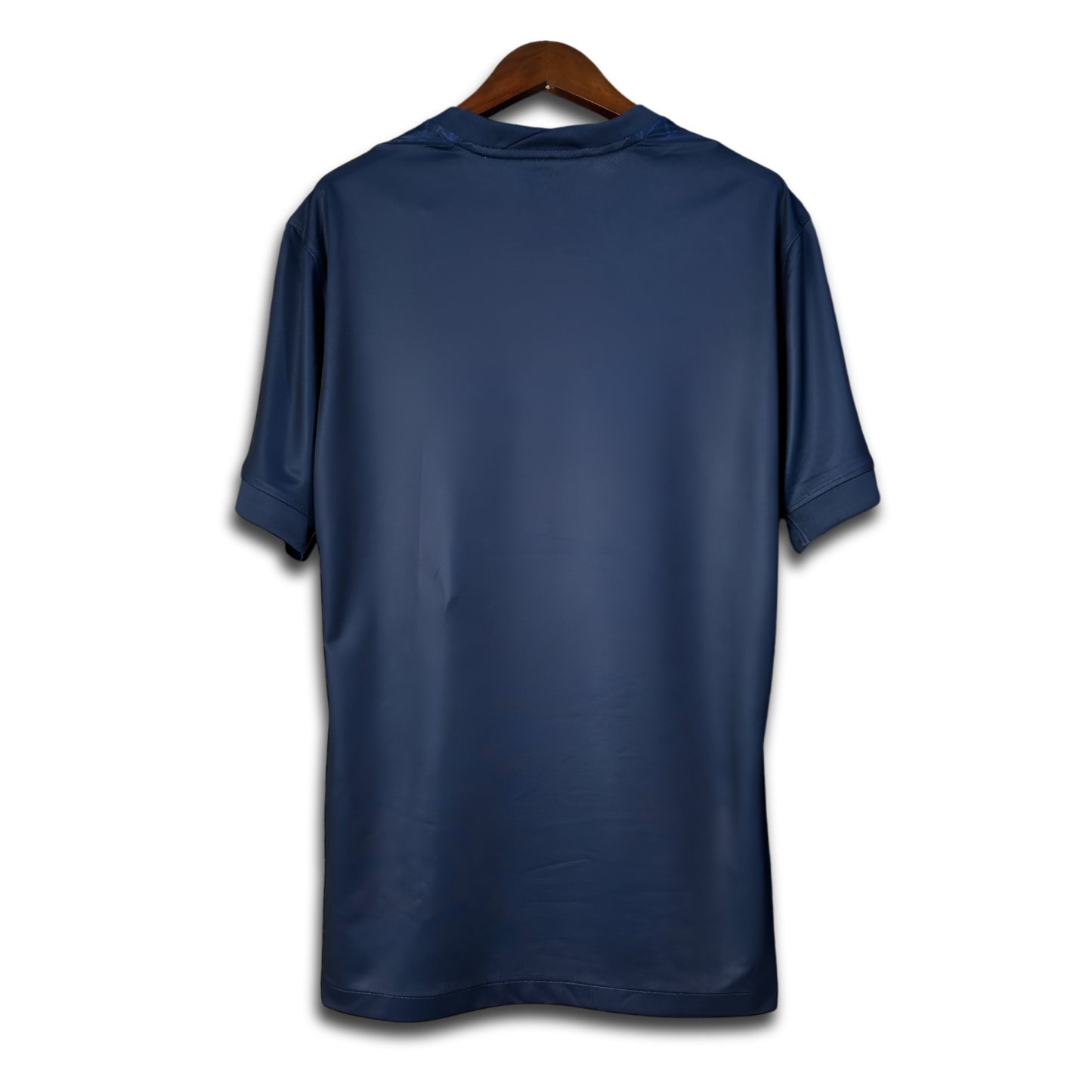 Blue Paris jersey on a wooden hanger against a white background