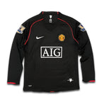 Manchester United jersey with AIG sponsor.