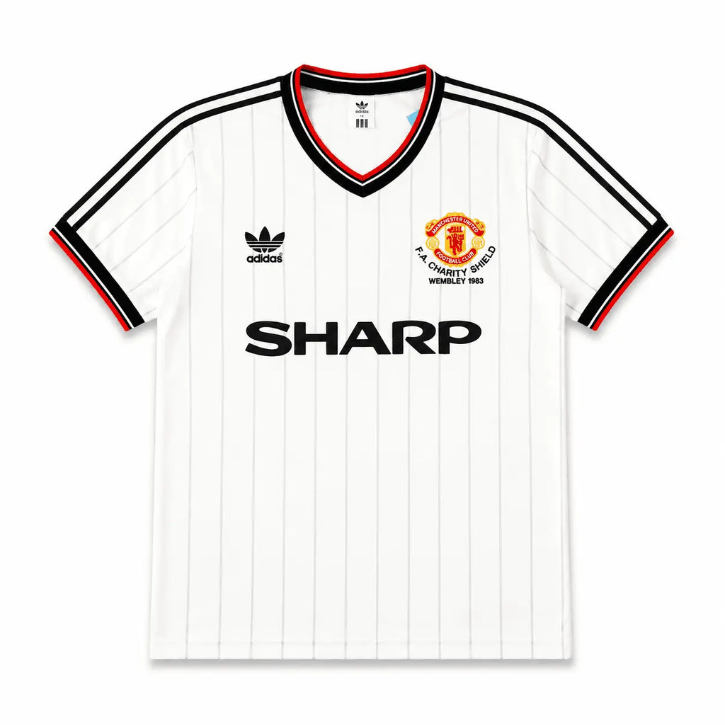 A white Adidas Manchester United home jersey with thin vertical pinstripes, featuring the black SHARP sponsor logo across the chest, the club crest on the right, and the black Adidas trefoil logo on the left. The collar and sleeve cuffs have black and red trim, and the sleeves feature black stripes.