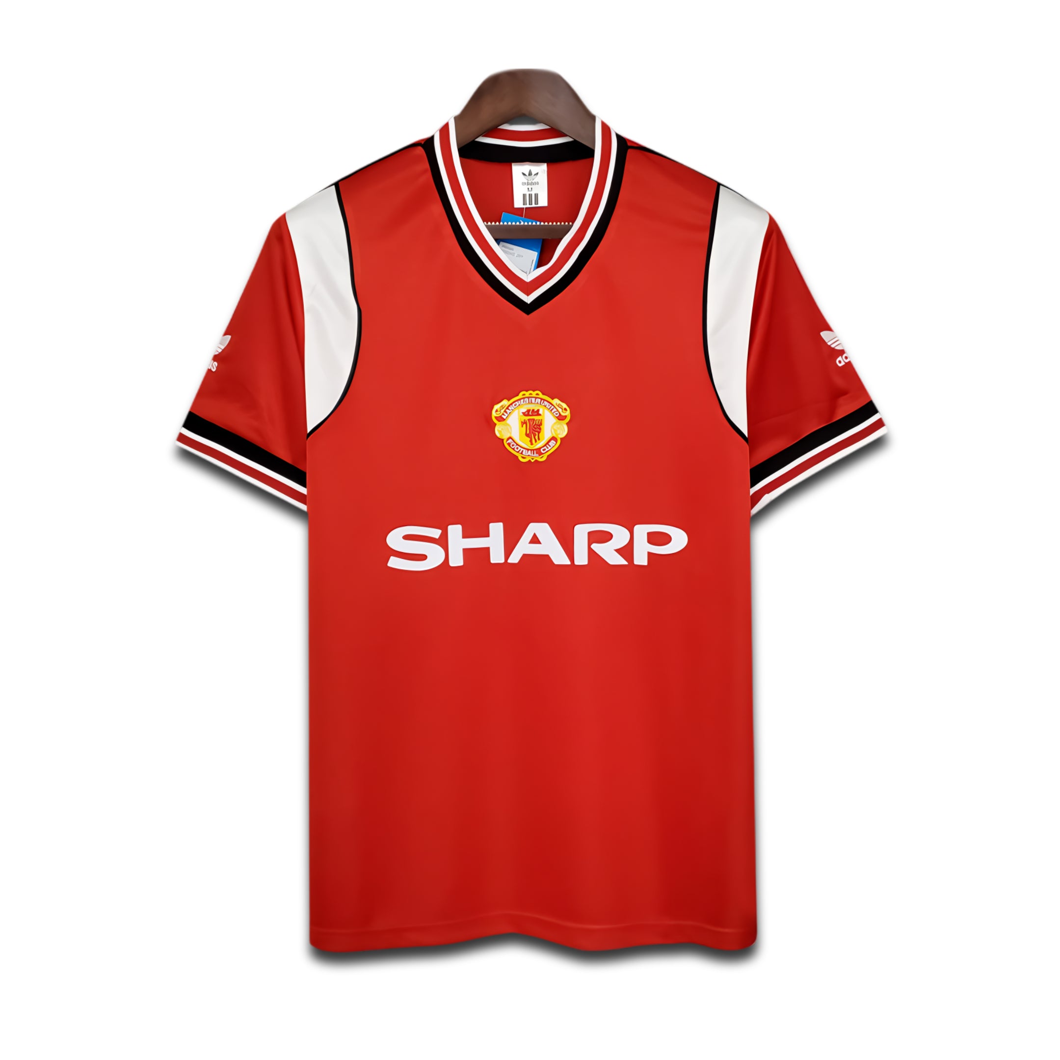Red Manchester United jersey with 'Sharp' logo on a white background