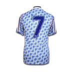 Blue and white patterned man united jersey with number 7 and Adidas logo on a white background