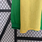 Green and yellow textured fabric draped over a black metal frame against a white background