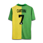 Green and yellow sports jersey with 'Cantona' and number '7' on a white background