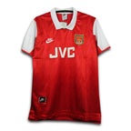 Red sports jersey with white accents and visible branding on a white background