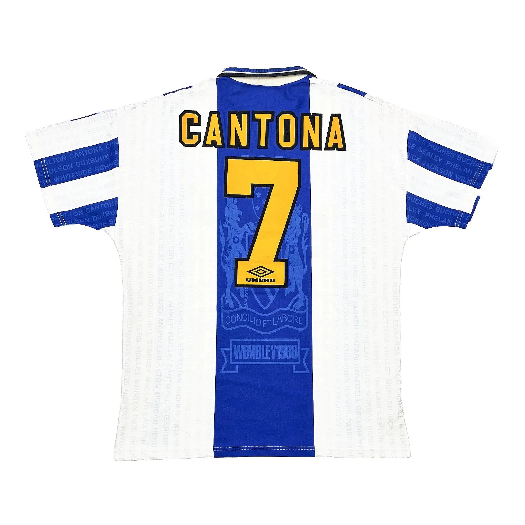 Back view of a white and blue football jersey with 'CANTONA' and the number '7' in yellow, featuring the Umbro logo and Wembley 1980 text.