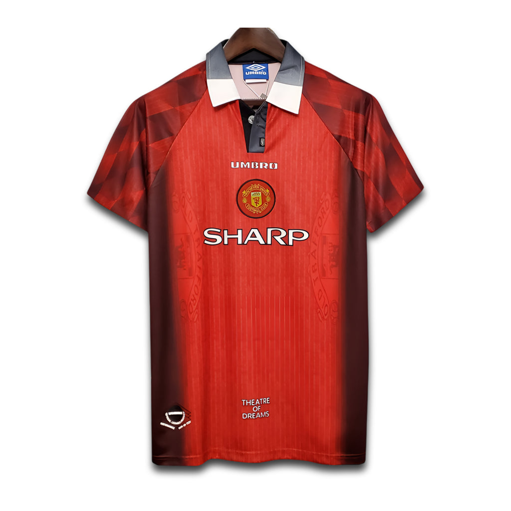 Red sports jersey with visible branding on a white background