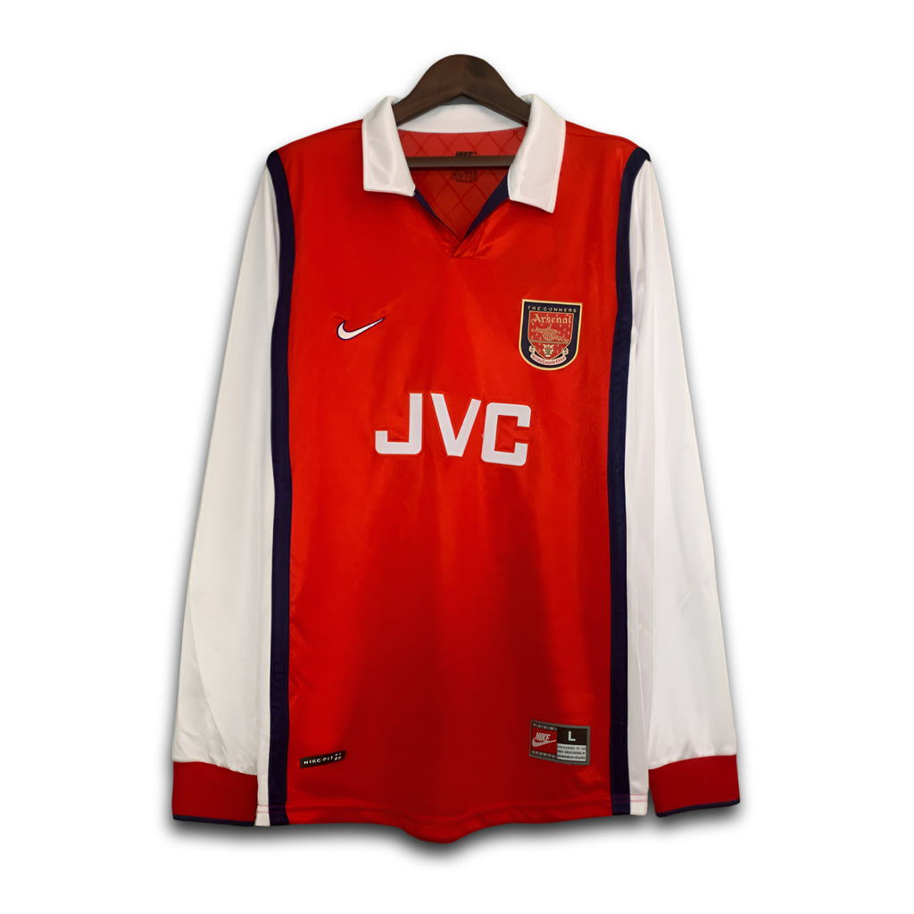 Red and white sports jersey with Nike and JVC logos on a hanger