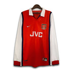 Red and white sports jersey with Nike and JVC logos on a hanger