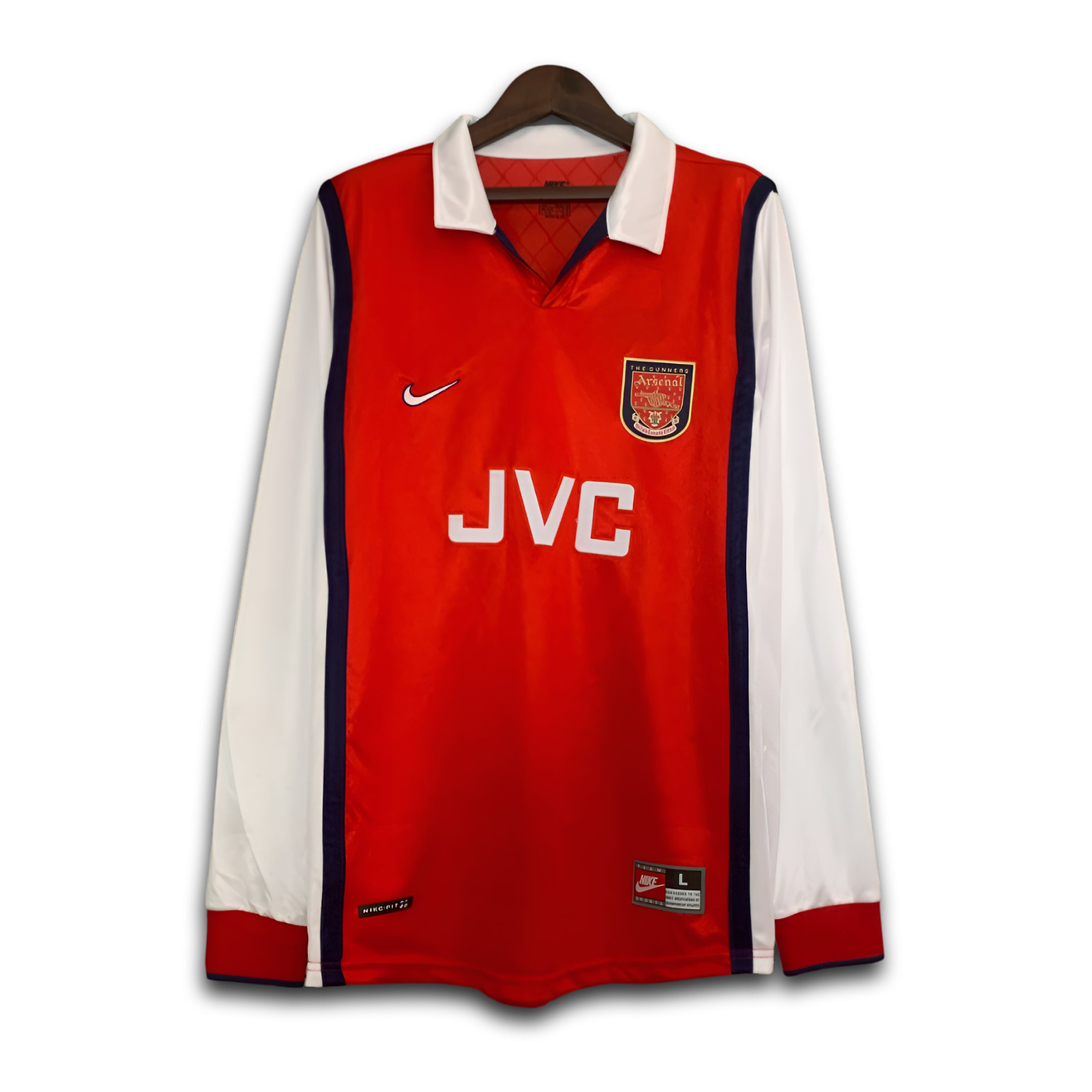 Red and white sports jersey with Nike and JVC logos on a hanger