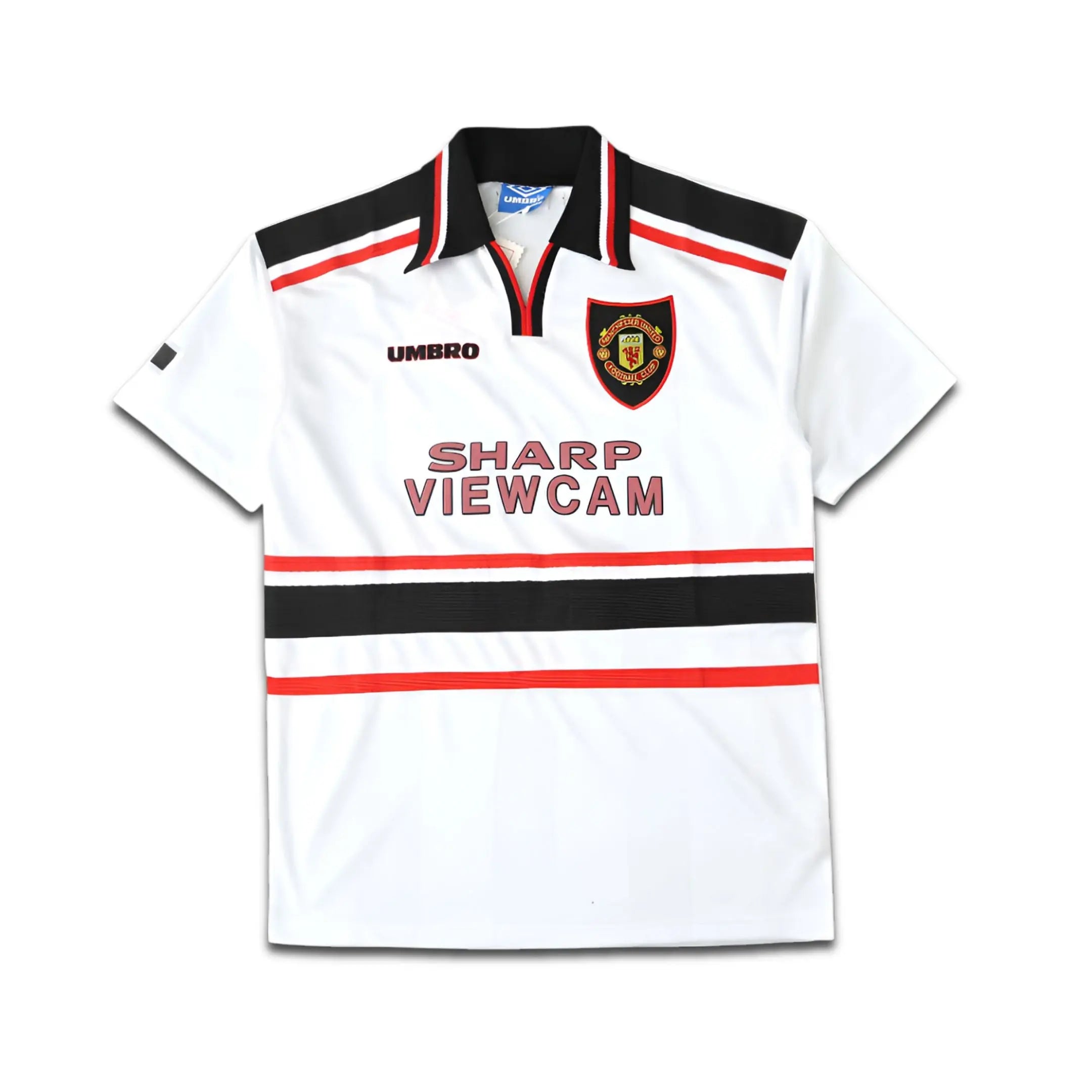 White Umbro Manchester United jersey with black and red accents, featuring a logo and text on a white background
