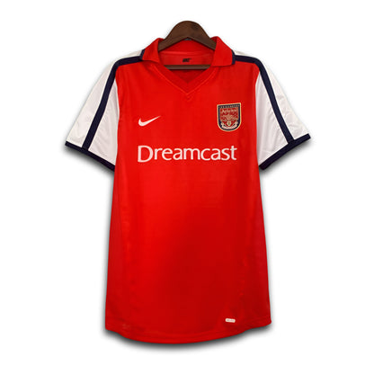 Red Arsenal jersey with 'Dreamcast' branding on a white background