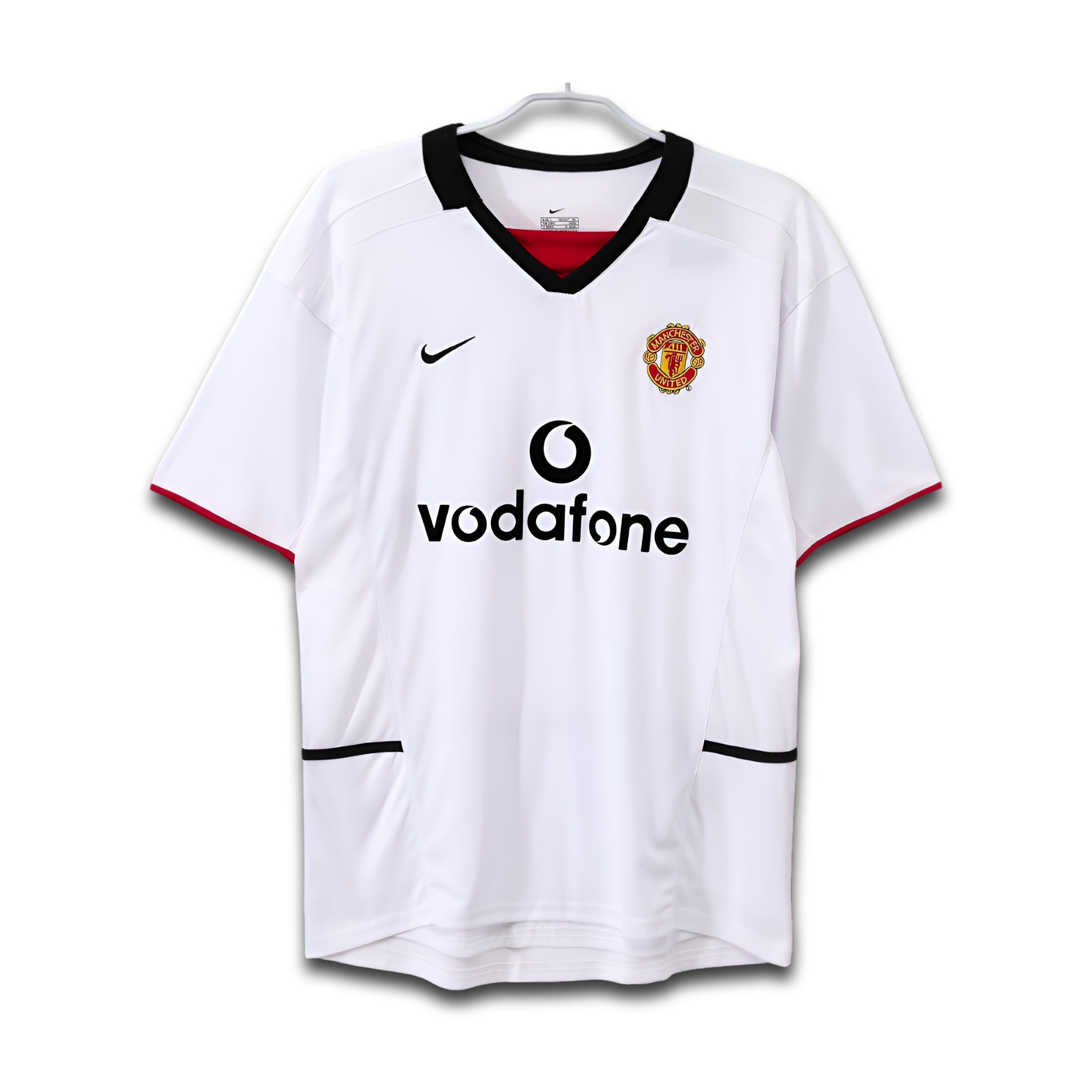 White manchester united jersey with Vodafone logo on a white background