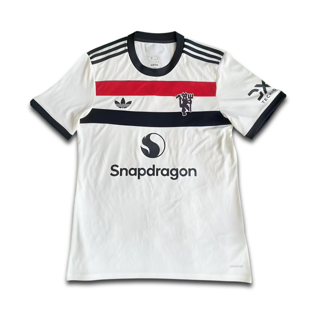 White sports jersey with black, red, and blue accents on a white background