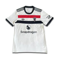 White sports jersey with black, red, and blue accents on a white background