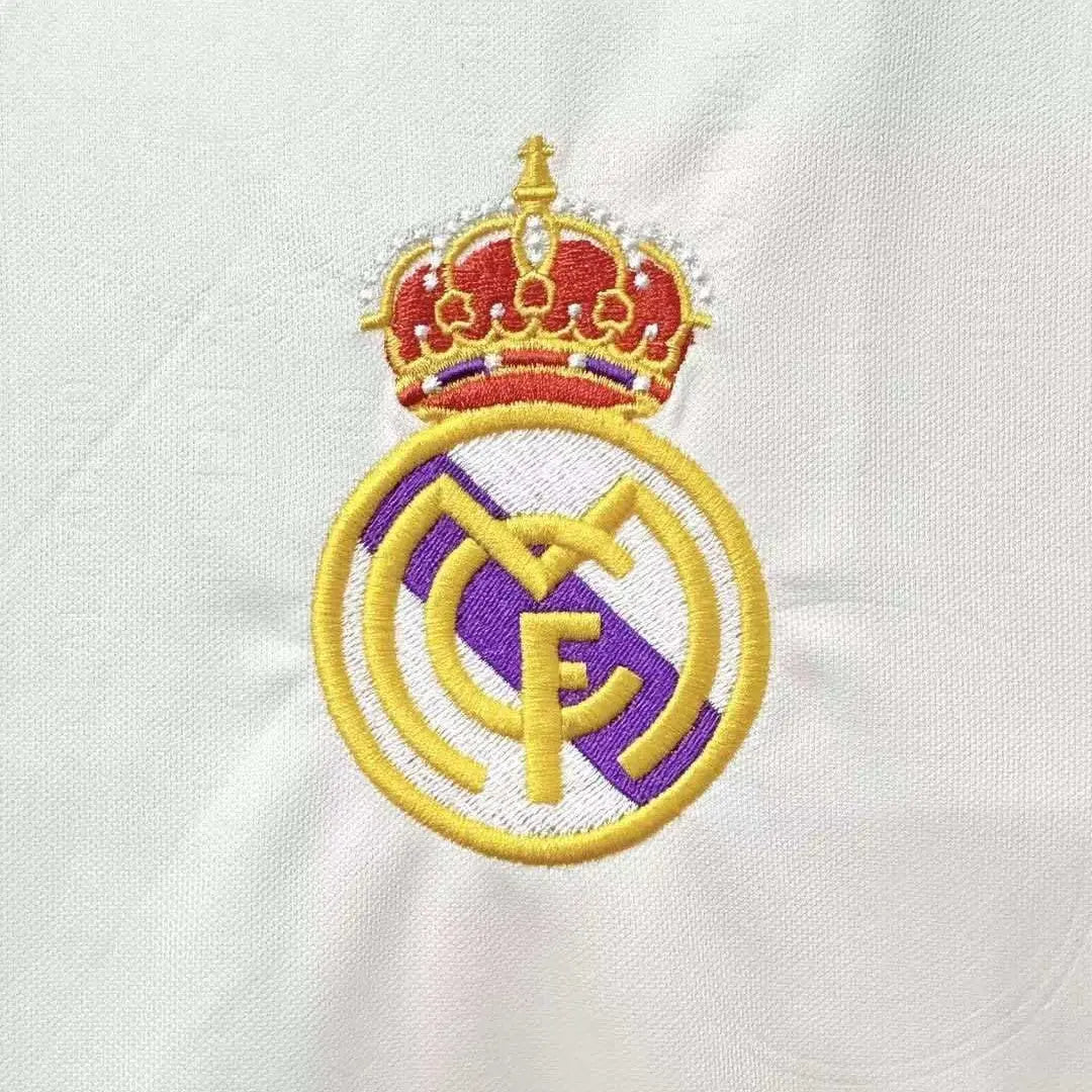 Embroidered logo with a crown on a white background
