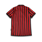 Rear view of the AC Milan Centenary Home shirt sitting on a white background.