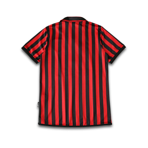 Rear view of the AC Milan Centenary Home shirt sitting on a white background.