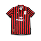 AC Milan Centenary Home shirt sitting on a white background.