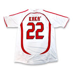 White soccer jersey with red trim, featuring 'KAKA' and the number '22' printed on the back.