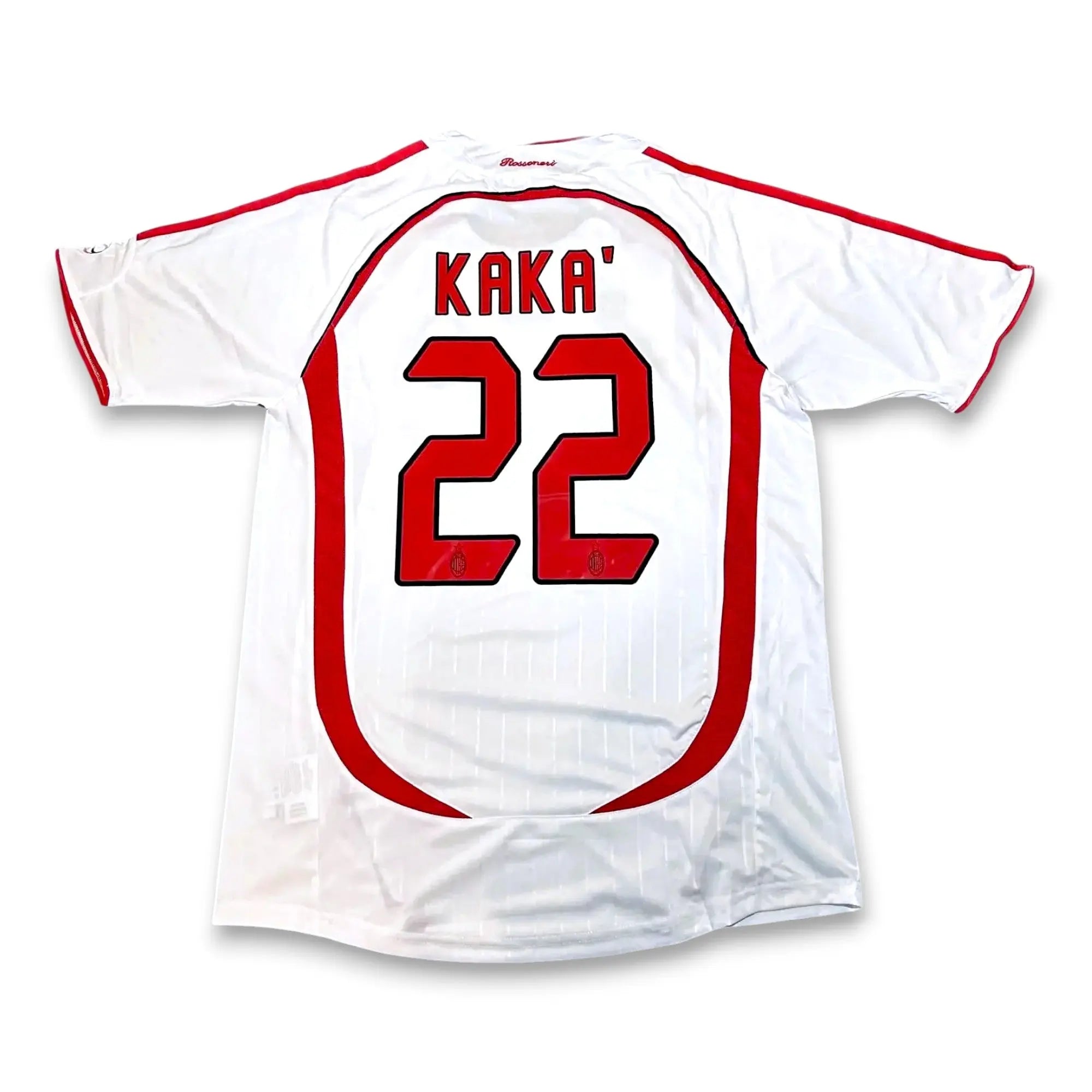 White soccer jersey with red trim, featuring 'KAKA' and the number '22' printed on the back.