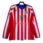 Red and white striped shirt with Spider-Man logo on a hanger