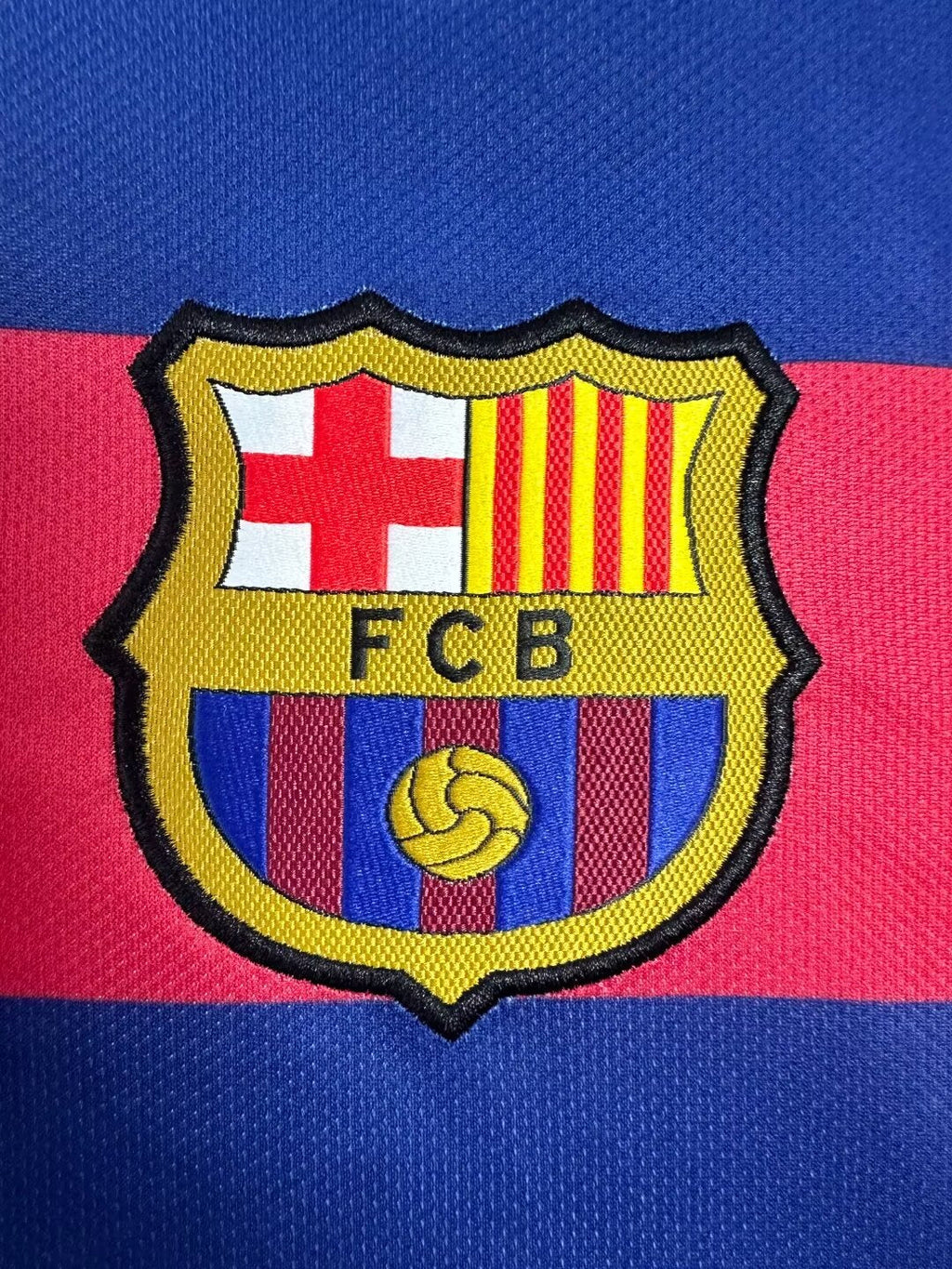 FCB logo on a blue and red striped background