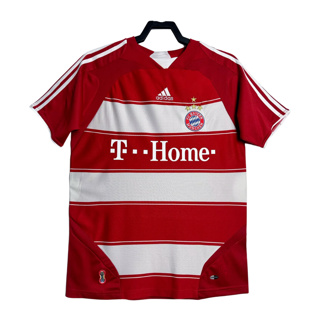 Red and white sports jersey with Adidas logo on a hanger
