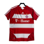 Red and white sports jersey with Adidas logo on a hanger