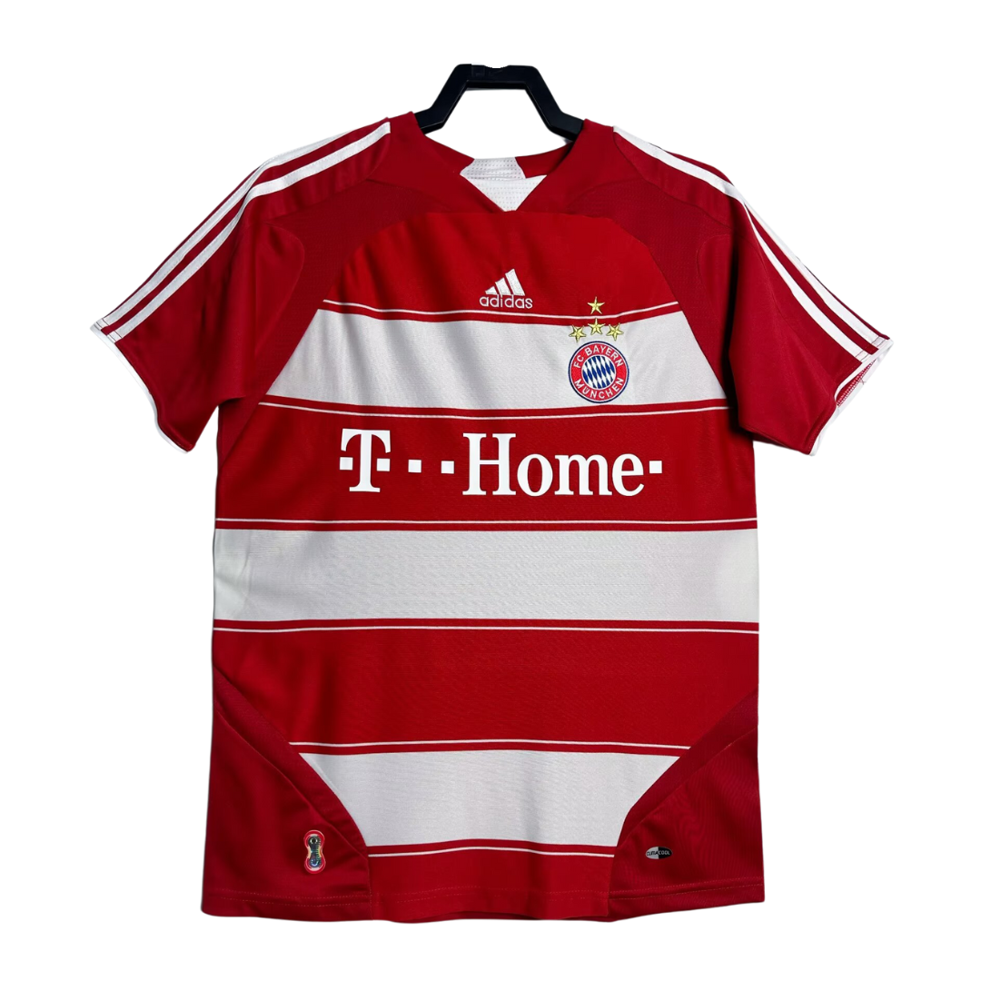 Red and white sports jersey with Adidas logo on a hanger