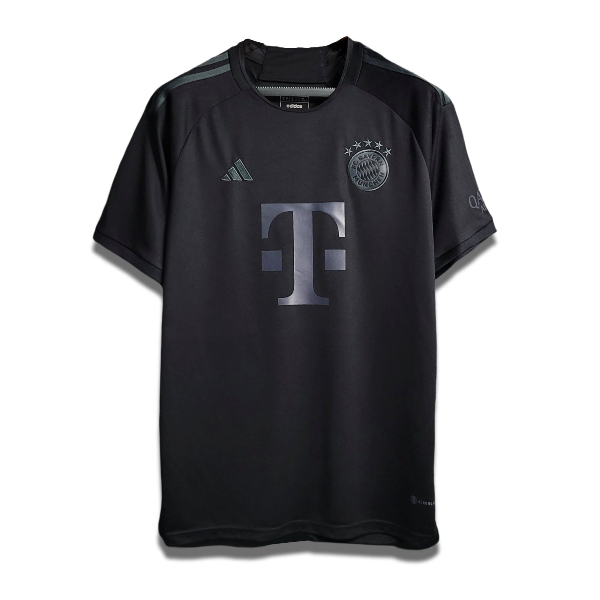Limited Edition Blackout Home shirt from Bayern Munich's 2023/24 Season, predominantly black with a large 'T' logo on the front.