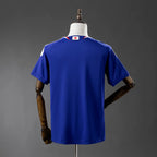 Blue sports jersey on a mannequin against a gray background
