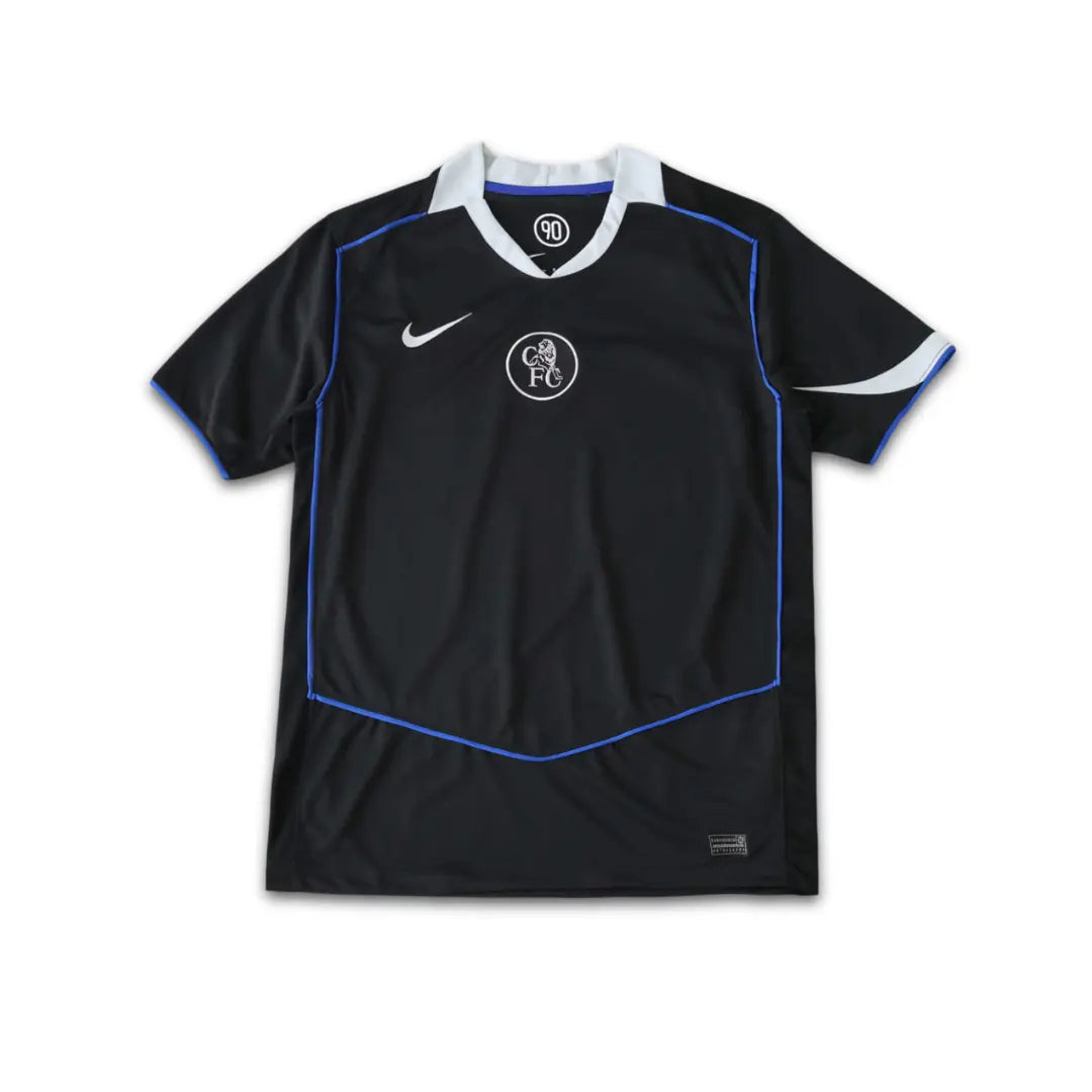 Black Chelsea sports jersey with blue accents and Nike logo on a white background