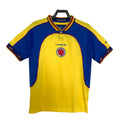 Yellow and blue Reebok Colombia soccer jersey with a logo on a white background