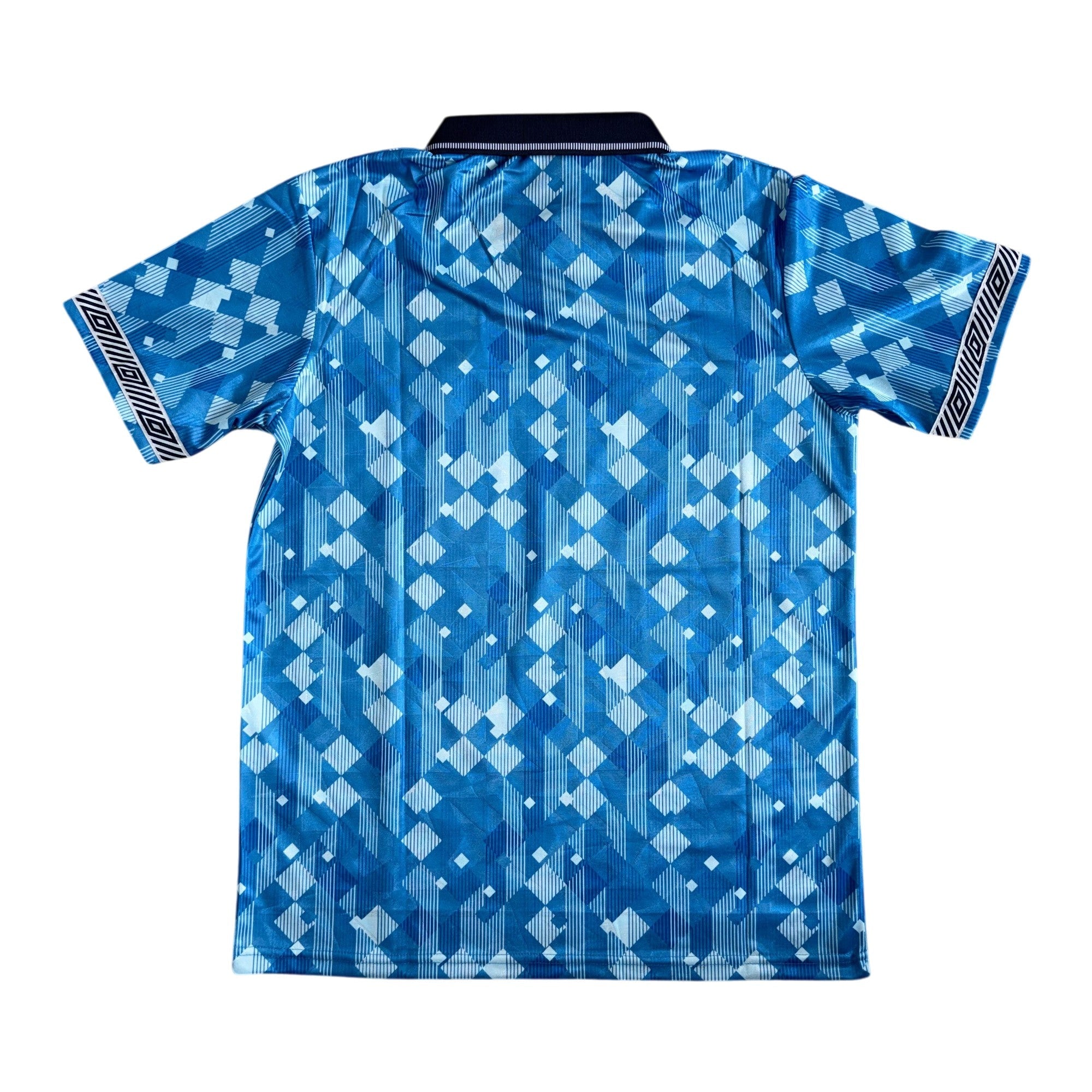 A short-sleeve athletic jersey with a blue and white geometric pattern, featuring a black collar and striped detailing on the sleeve cuffs, shown against a plain white background.