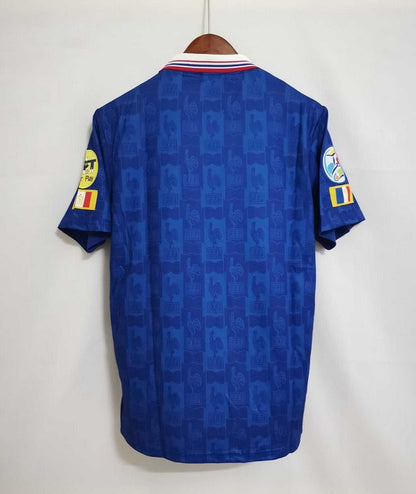 Blue sports jersey with visible branding on a white background