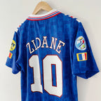 Blue soccer jersey with 'Zidane' and number '10' on a hanger against a white background