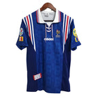 Blue sports jersey with Adidas logo on a white background