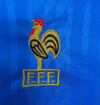 Embroidered France rooster logo with 'FFF' on a blue background