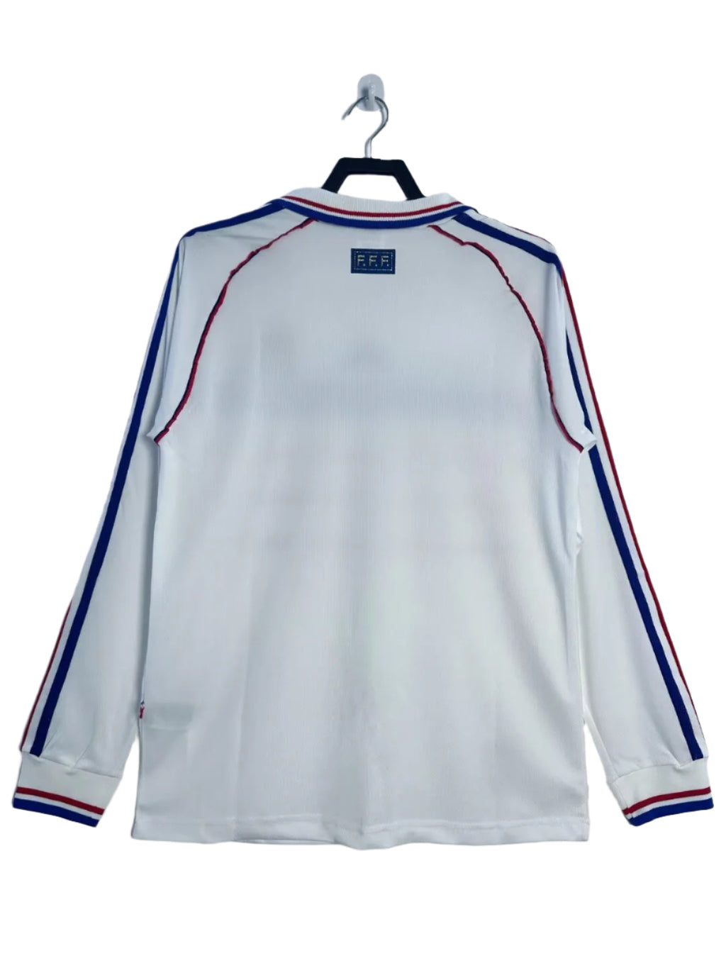 White long-sleeve shirt with blue and red accents on a hanger against a white background