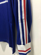 Blue sports jersey with white and red stripes on a white background