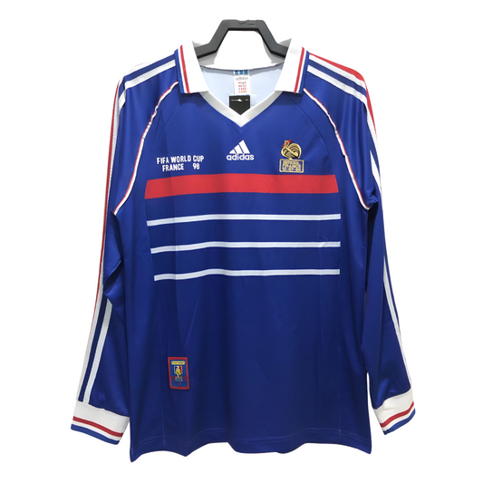 Blue sports jersey with white and red accents on a hanger