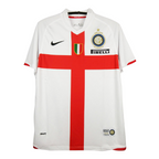 White soccer jersey with red cross and brand logos on a white background