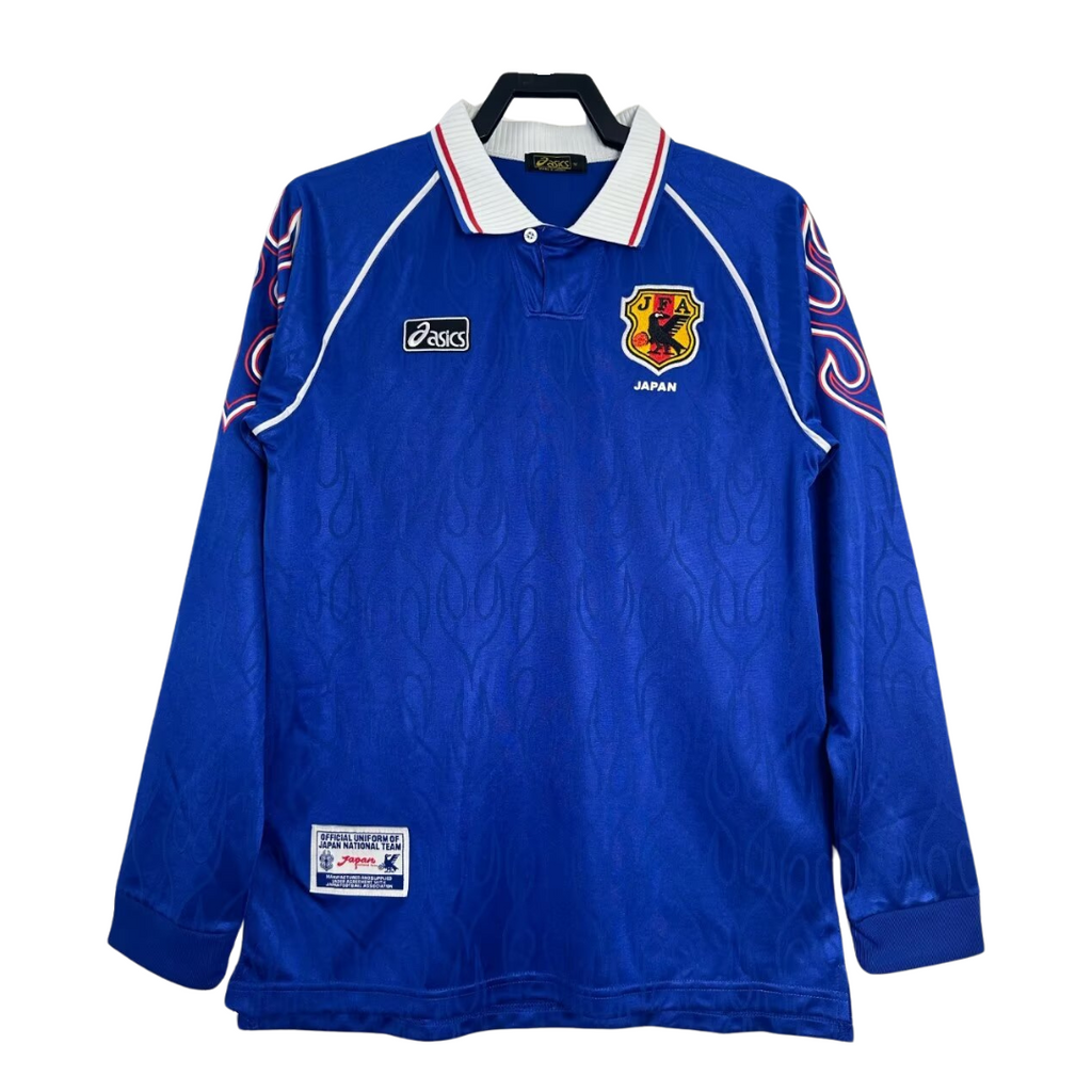 Blue Japan soccer football jersey with a logo and text on a white background