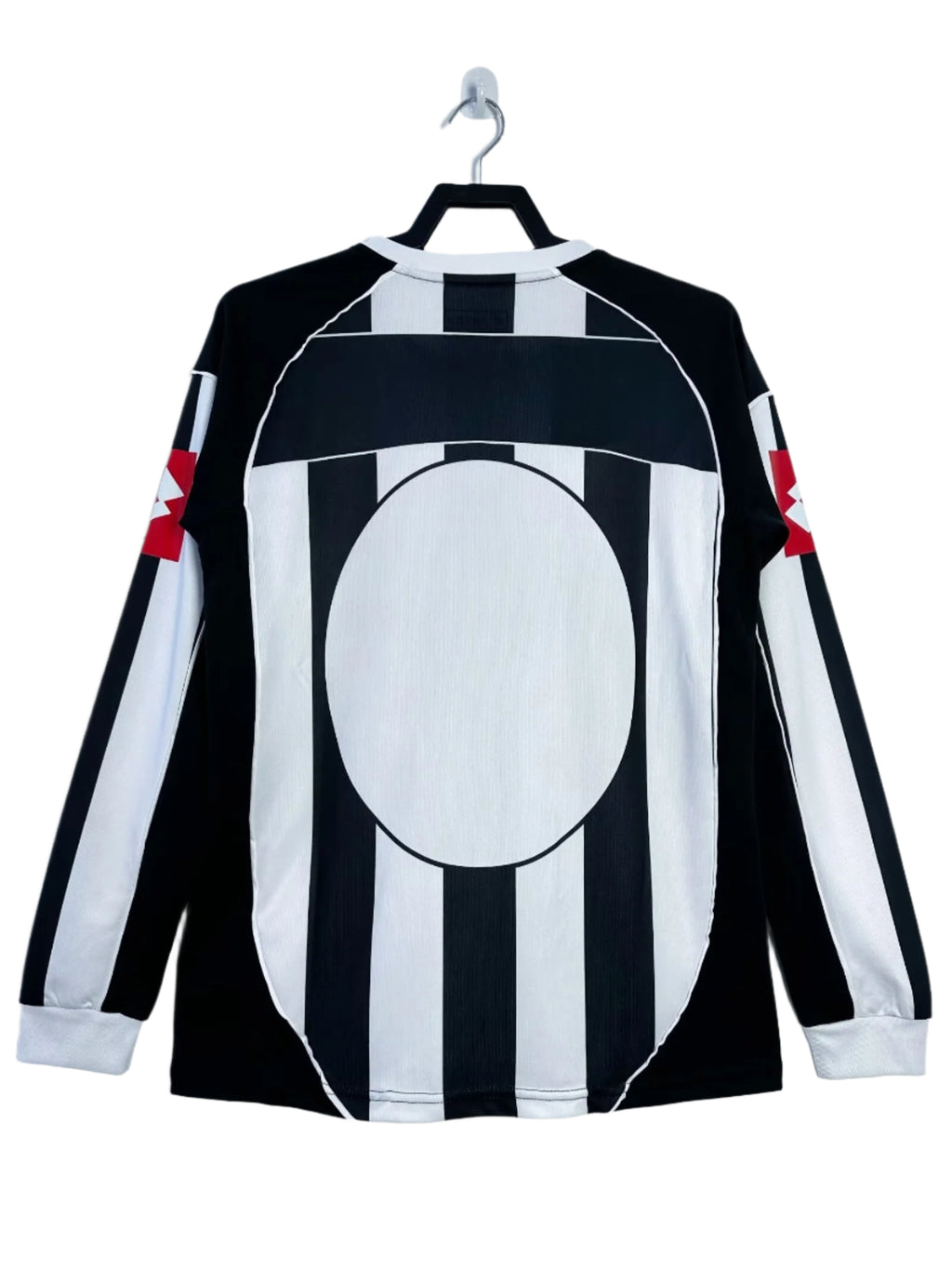 Black and white striped shirt with red accents on a hanger against a white background