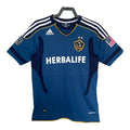 Blue sports jersey with Adidas and Herbalife logos on a white background